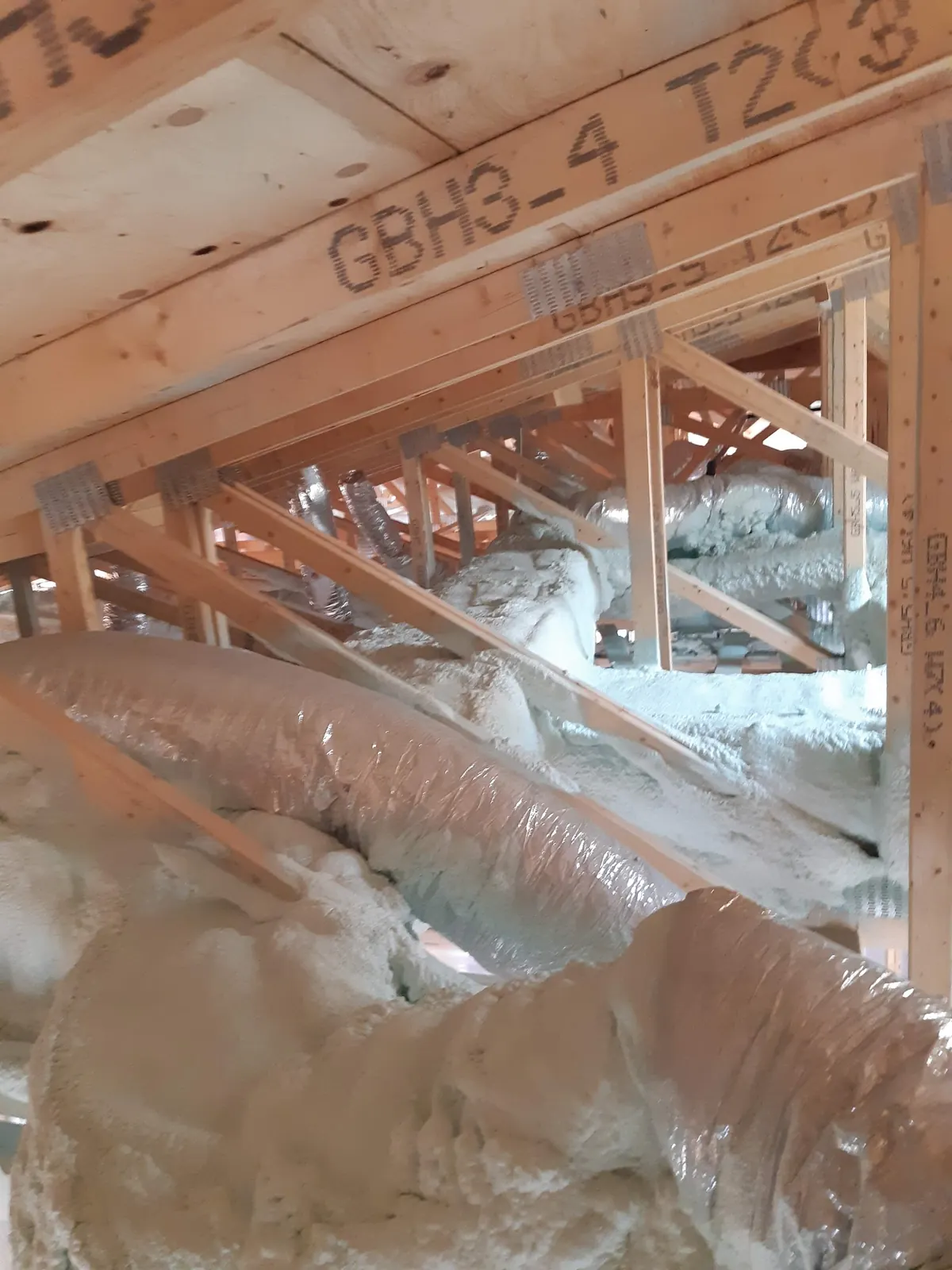2" (R12) of 2lb closed-cell spray foam encapsulating sheet-metal attic HVAC ductwork in Pickering (Rougemount & Dunbarton) [JOB-2020-04-18-01]