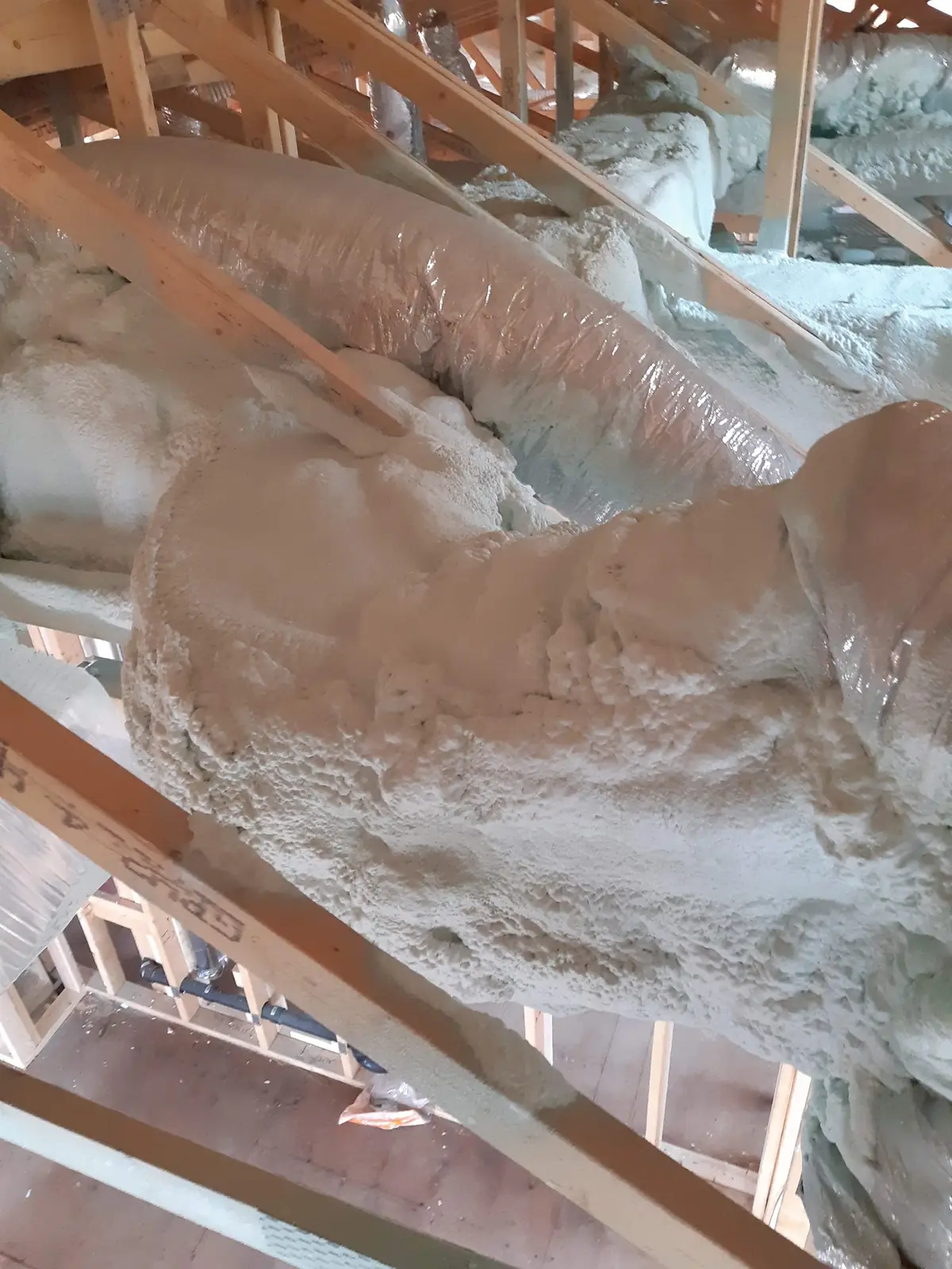 2" (R12) of 2lb closed-cell spray foam encapsulating sheet-metal attic HVAC ductwork in Toronto (Forest Hill & Rosedale) [JOB-2020-04-18-01]